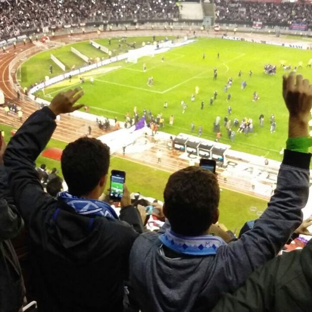 Guys celebrating goal at River Plate soccer game