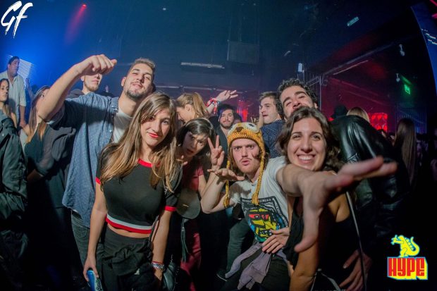 Night club posed girls, crowd and stupid hat guy