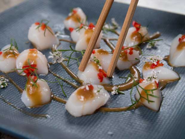 Chopsticks and sushi on plate at Osaka, Puerto Madero