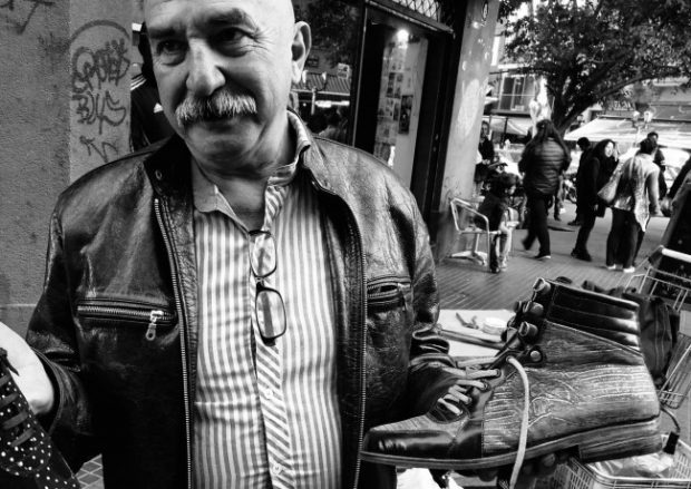 San Telmo market leather boot salesman