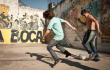kids playing soccer in a plaza in La Boca, Buenos Aires