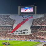 Massive River Plate jersey held by crowd in El Monumental stadium