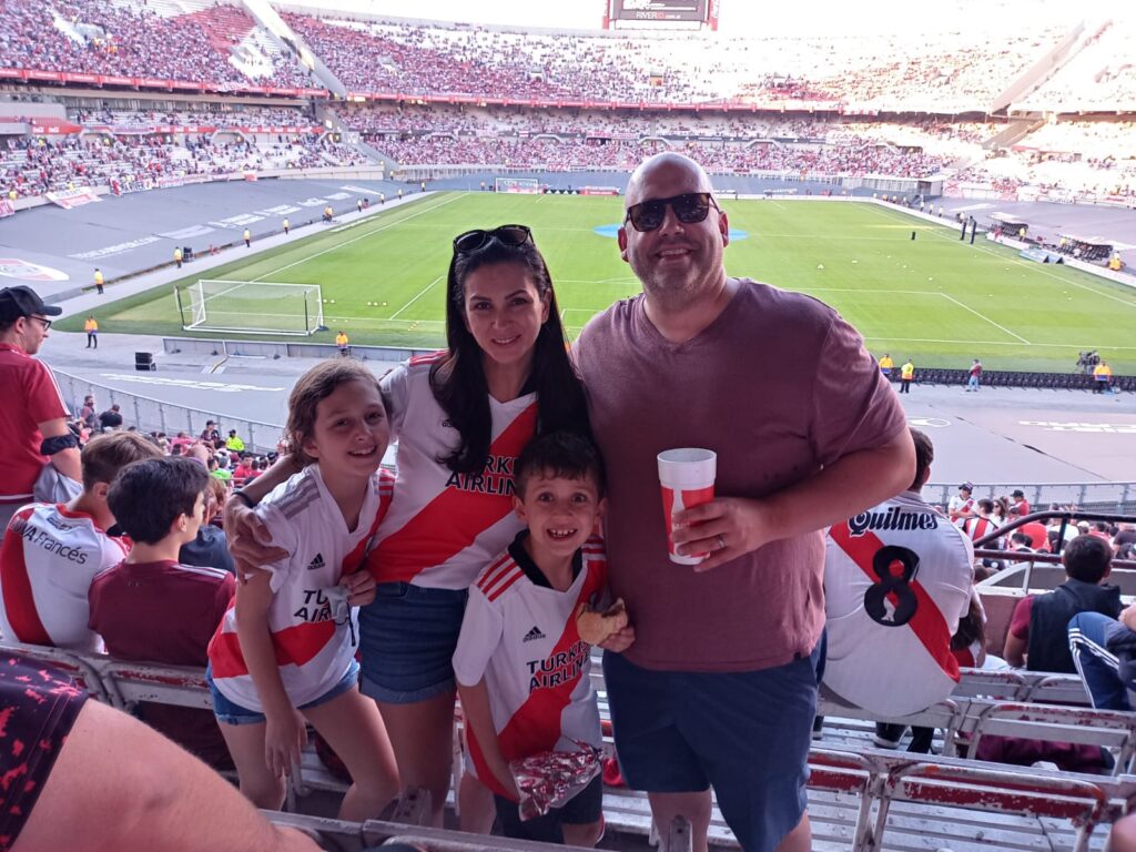 Travelers enjoying a game at River Plate stadium