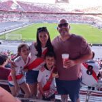 Travelers enjoying a game at River Plate stadium
