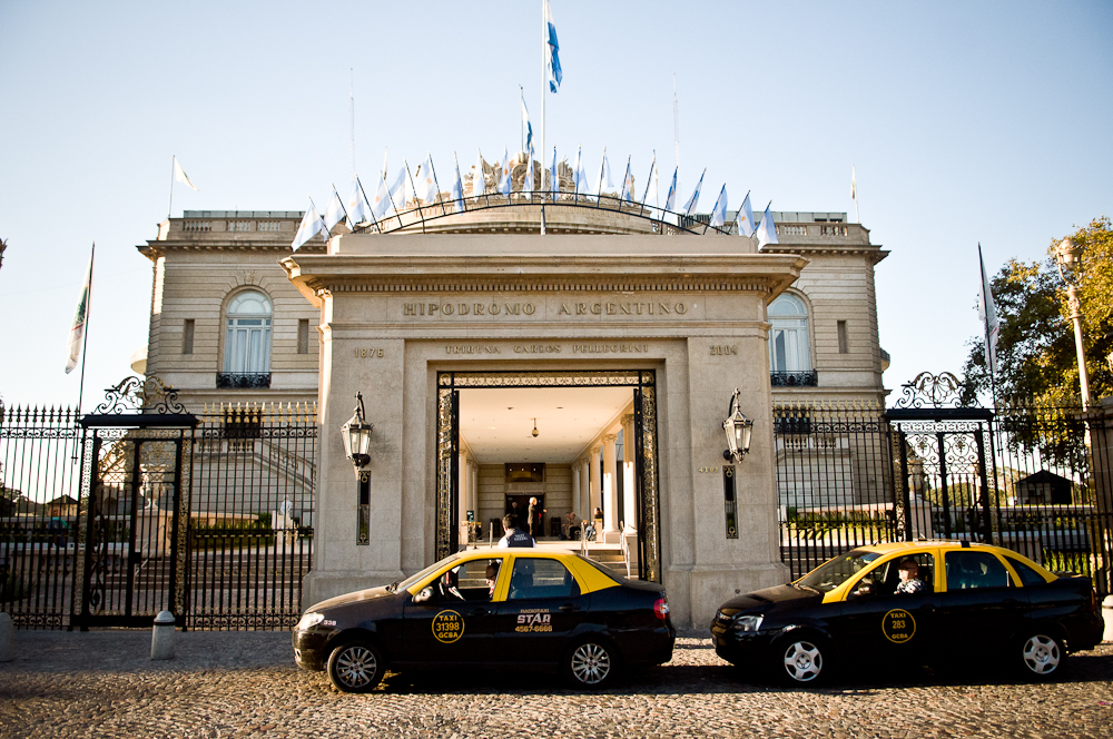 Traveler tipping taxi upon drop off in Buenos Aires