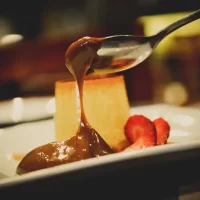 Dulce de leche with flan presented as a food you must try in Buenos Aires